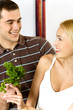 Young attractive happy smiling couple at the kitchen Young attractive happy smiling couple at the kitchen