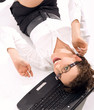 Young businesswoman with notebook rolling on the floor