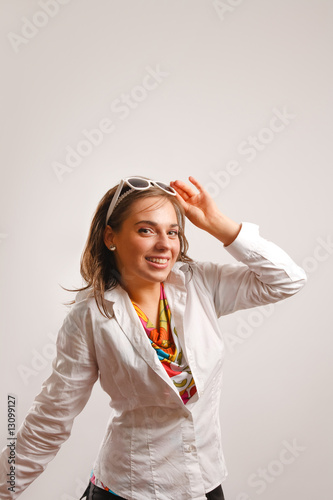 Photo: Beautiful young woman wearing white jacket Beautiful young woman wearing white jacket