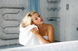 girl in bathroom with towel