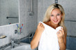 girl in bathroom with towel