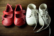 two pairs of worn and dirty baby shoes two pairs of worn and dirty baby shoes