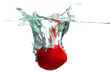 Strawberry falling in water