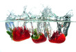 Strawberrys falling in water