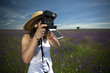 young woman with instant photo camera