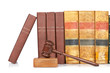 Photo: Wooden gavel and old law books Wooden gavel and old law books