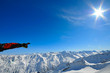 Man hand pointing out in mountains.