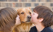 Boys Kissing Dog