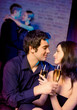 Two amorous couples celebrating together at restaurant