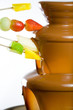 Dipping fruits into a Chocolate Dipping fruits into a Chocolate