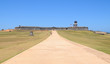 Broad path leading across a field to a low fort Broad path leading across a field to a low fort