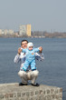 father and his son are walking outside
