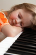 Girl sleeping at piano