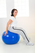 Woman exercising with fitness ball