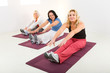 Women doing exercices on mat