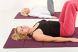 Women doing exercices on mat