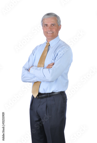 Photo: Standing Businessman with arms crossed Standing Businessman with arms crossed