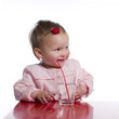 Happy toddler with glass of water