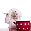 Toddler pretending to cook with a big red pot.