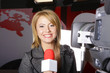 television news reporter and video camera in live transmission