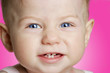 baby girl with blue eyes smiling