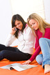 Girls browsing magazine
