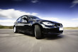 Photo: Black Car In Motion Black Car In Motion