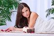 Pretty woman on the massage table for a spa treatment Pretty woman on the massage table for a spa treatment