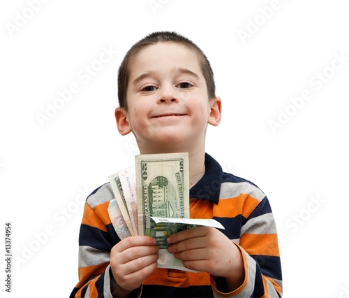 Photo: Cute little boy holds a fan of banknotes Cute little boy holds a fan of banknotes