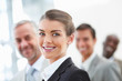 Blur image of a cheerful business woman with her staff