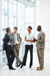 Business colleagues busy in a discussion at the hallway