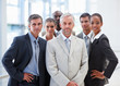 A proud business team standing together