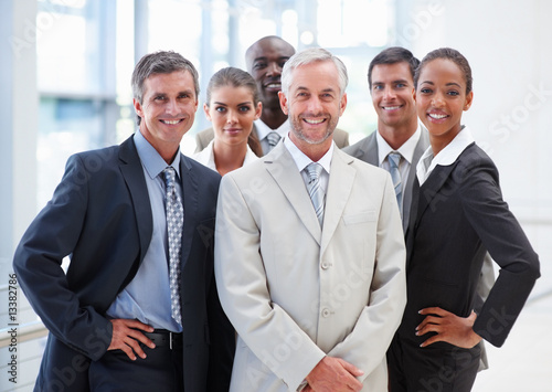Photo: Group of business colleagues confidently standing together Group of business colleagues confidently standing together