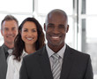 Business team looking at camera and smiling