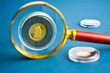 Coins and magnifier