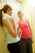 Two girls in locker room after training Two girls in locker room after training