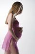 Image of pregnant woman touching her belly with hands..