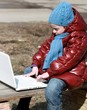 Girl on bench with laptop