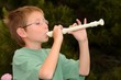 Photo: Boy playing a recorder Boy playing a recorder