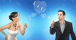 Wedding couple blowing heart shaped romantic soap bubbles