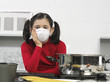 little girl in the kitchen with mask little girl in the kitchen with mask