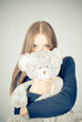 Beautiful blonde teenager holding a teddy bear Beautiful blonde teenager holding a teddy bear
