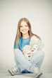 Beautiful blonde teenager holding a teddy bear Beautiful blonde teenager holding a teddy bear