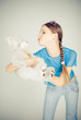 Beautiful blonde teenager kissing a teddy bear Beautiful blonde teenager kissing a teddy bear
