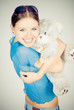 Beautiful blonde teenager holding a teddy bear Beautiful blonde teenager holding a teddy bear