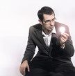 Businessman holding a light bulb