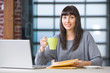 Young student using a laptop to study