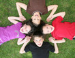 Family of Siblings Lying on the Grass Laughing