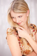 Cute blue eyes blond woman with little smile