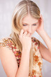 Portrait of a pretty blond woman looking down